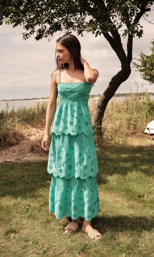 aqua eyelet midi dress Sun-kissed and effortlessly chic This dreamy aqua midi dress features delicate eyelet detailing, a flattering strapless silhouette, and tiered layers that move beautifully with every step. Perfect for beachside brunches, vacation